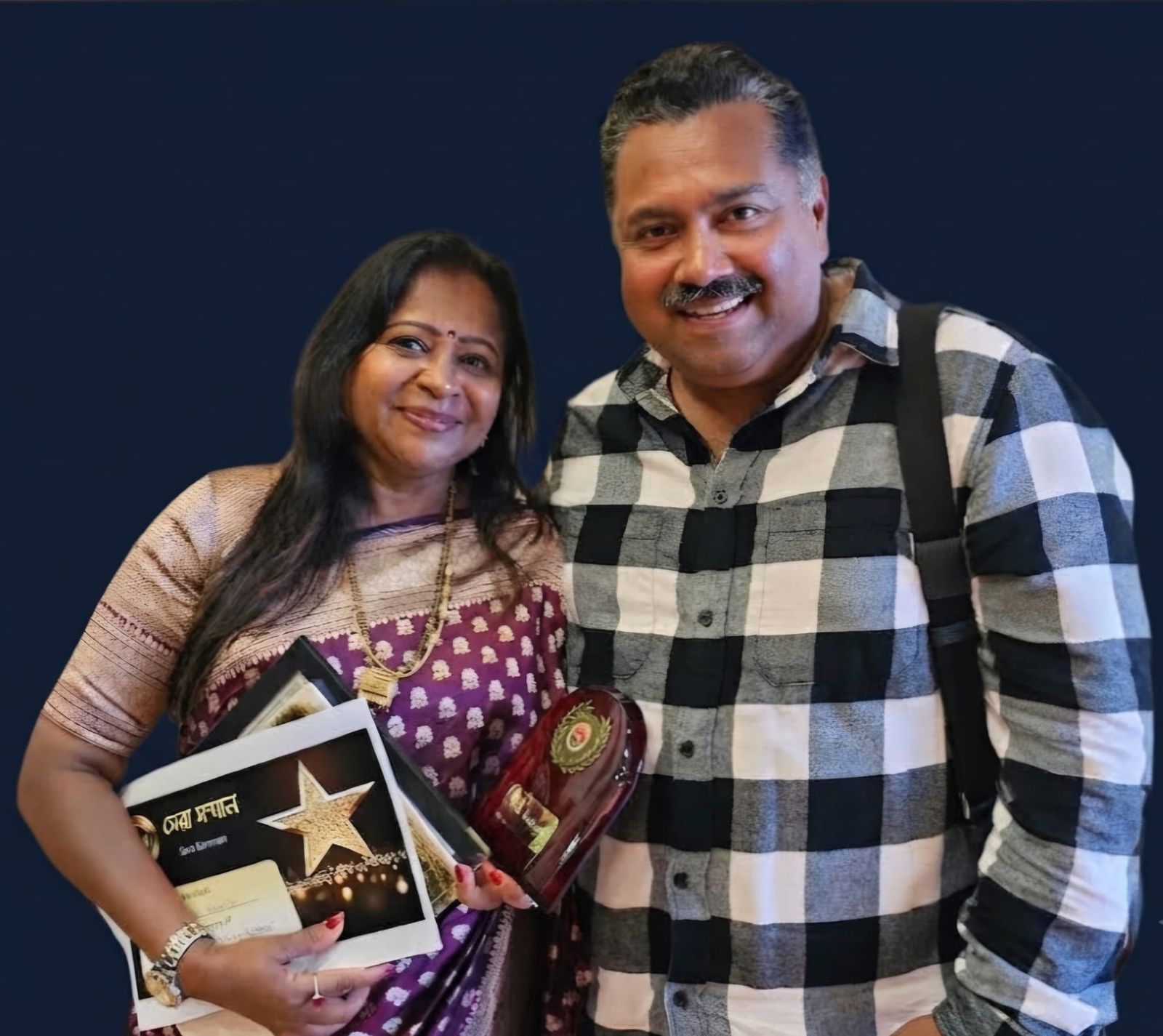 Bhavana Ghosh with the UKBC Sera Samman award certificate and trophy