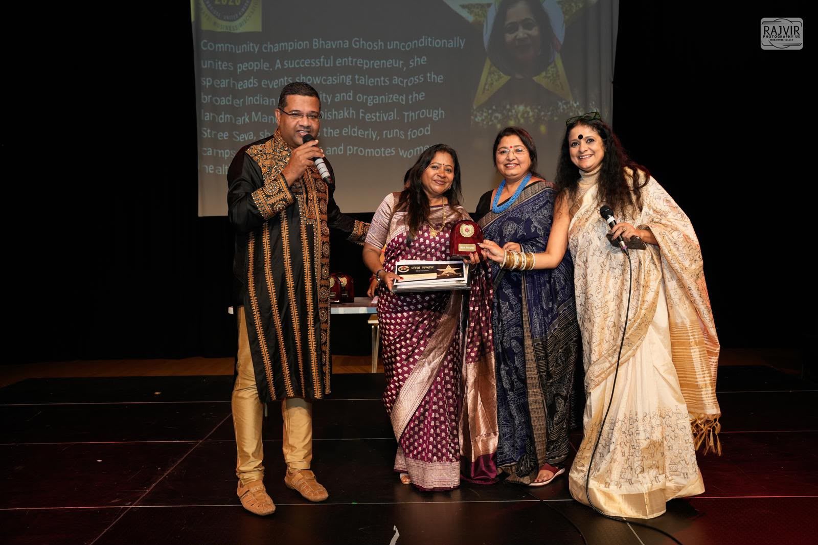 Bhavana Ghosh receiving the UKBC Bengali Sera Samman Award on stage in Cambridge