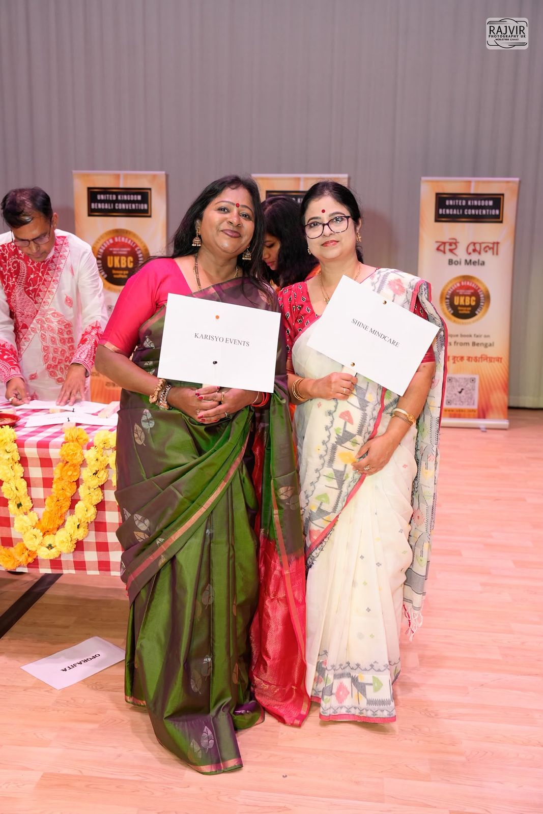 Bhavana Ghosh celebrating with a fellow honouree at the United Kingdom Bengali Convention
